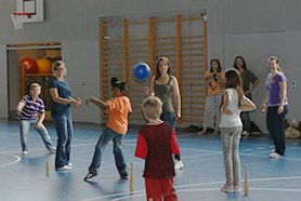 Mentors and Mentees playing in the gym. 